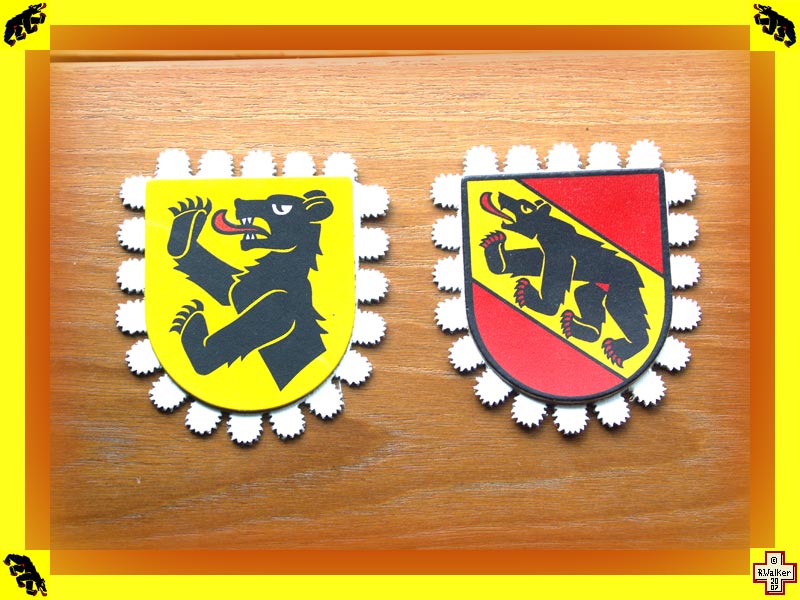 Photo: Zweisimmen Bern Bear (left) and Bern Bear (right) on leather cow bell strap decorations.