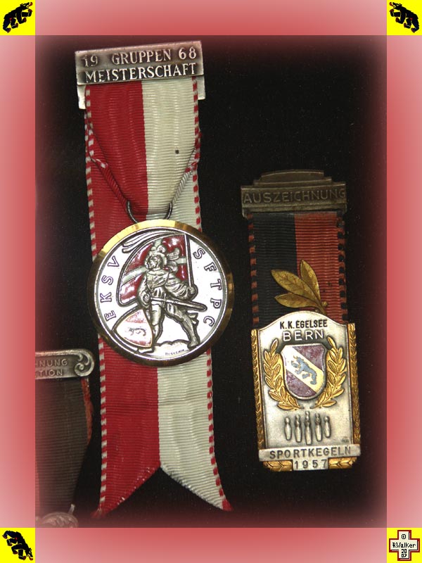 Photo: Bern Bear on shooting medal and 1957 bowling medal.